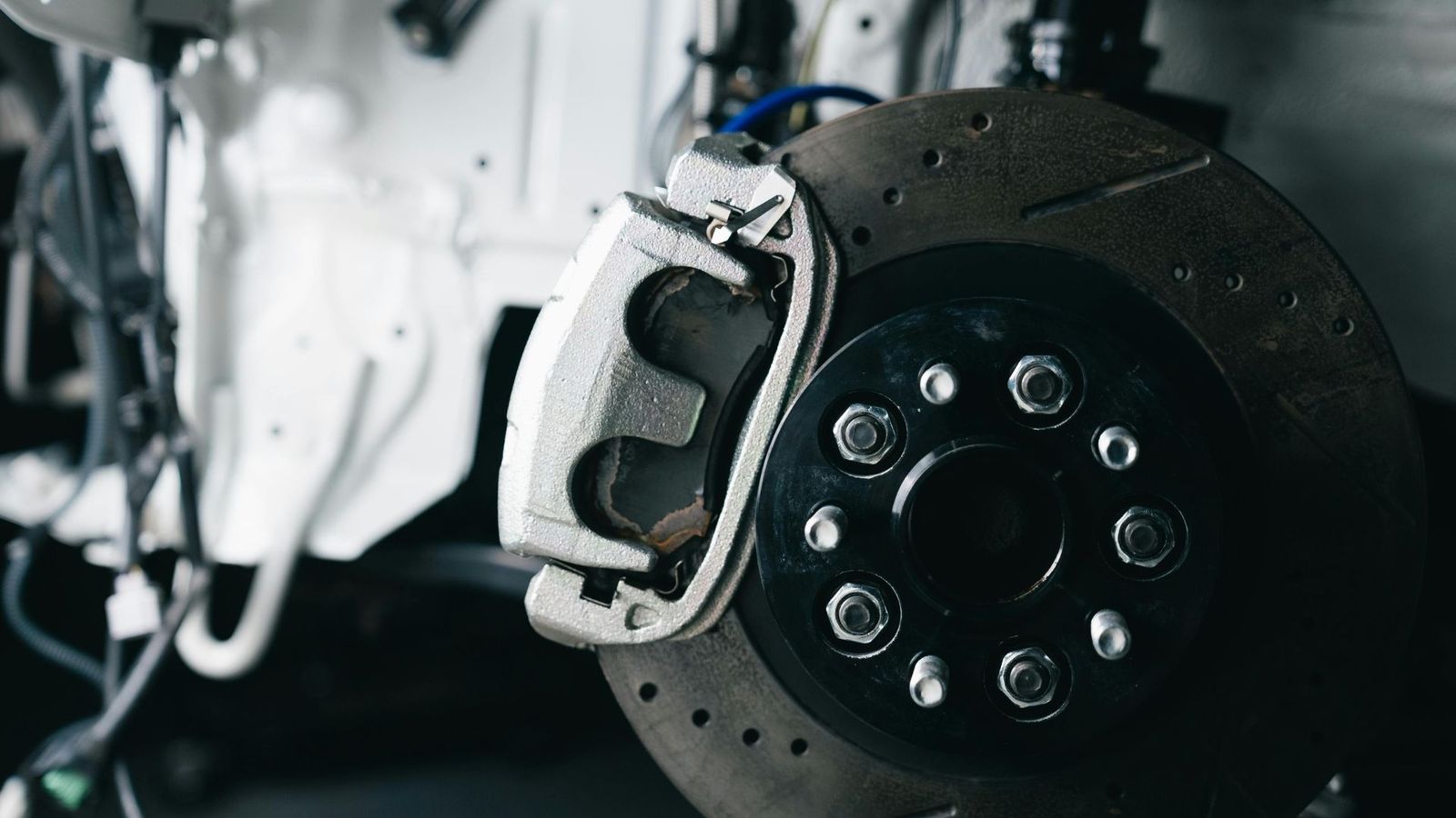 Performance brake caliper and drilled rotor