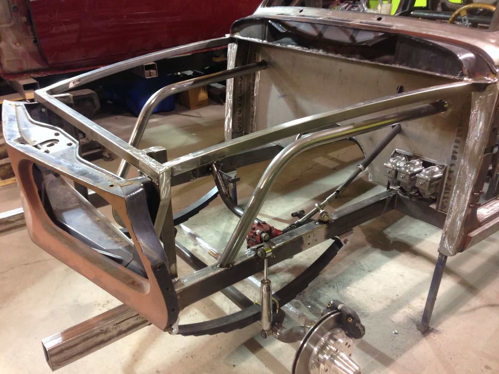 Custom fabricated chassis and roll cage on the shop floor
