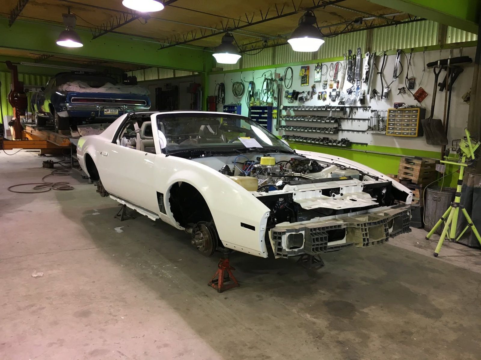 Sports car stripped for a frame-off restoration in the Iron City shop