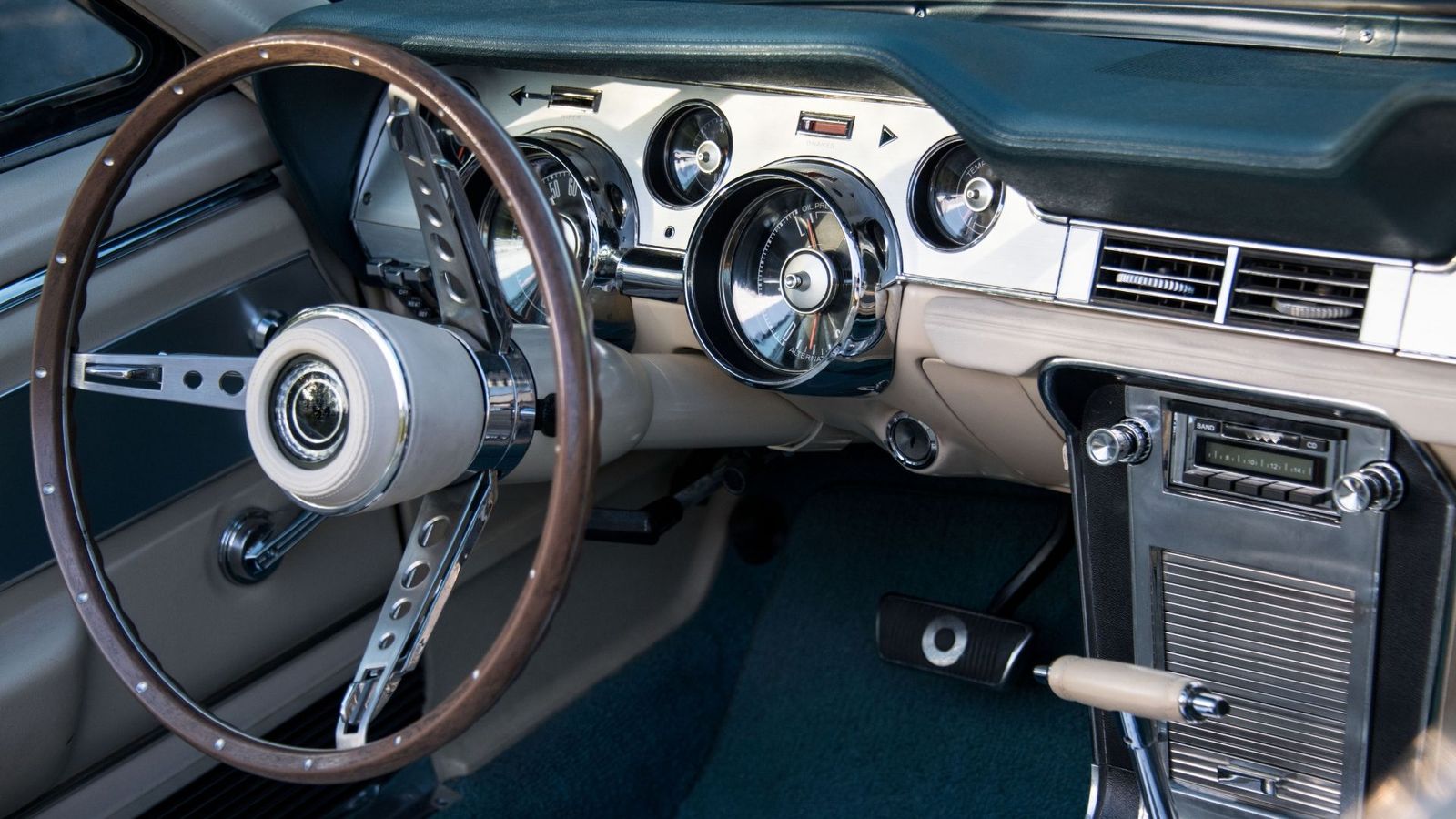 Restored classic Mustang interior with wood steering wheel