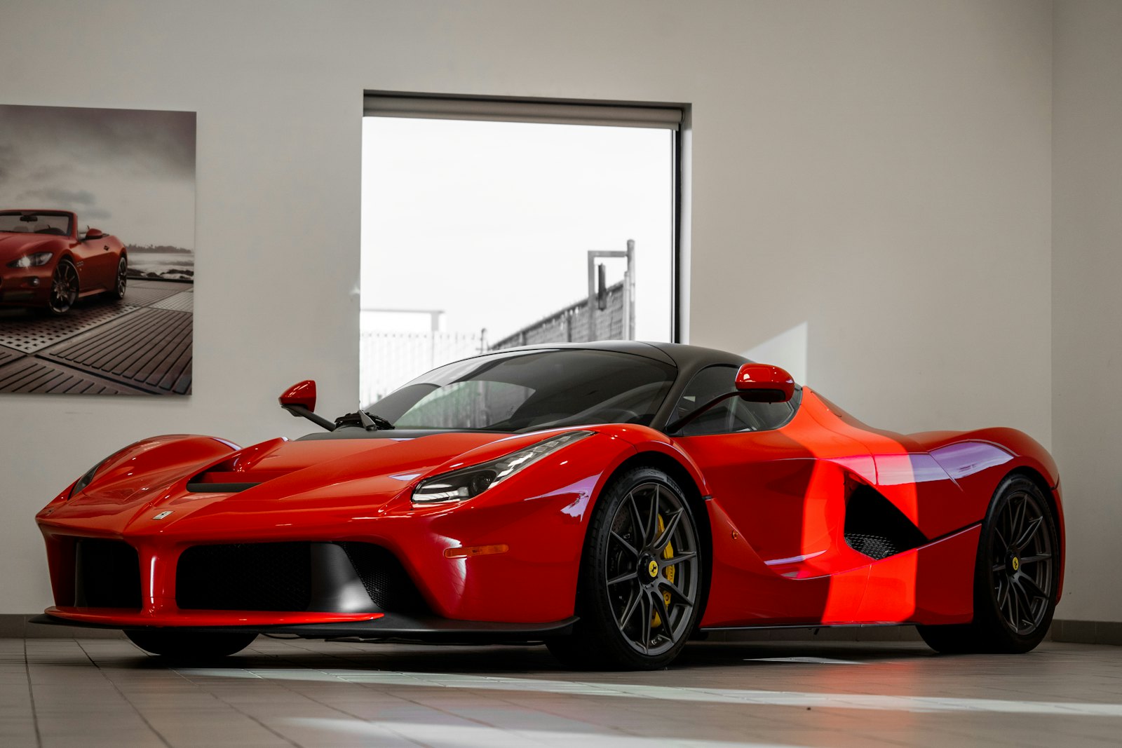 Red exotic supercar after paint and collision repair