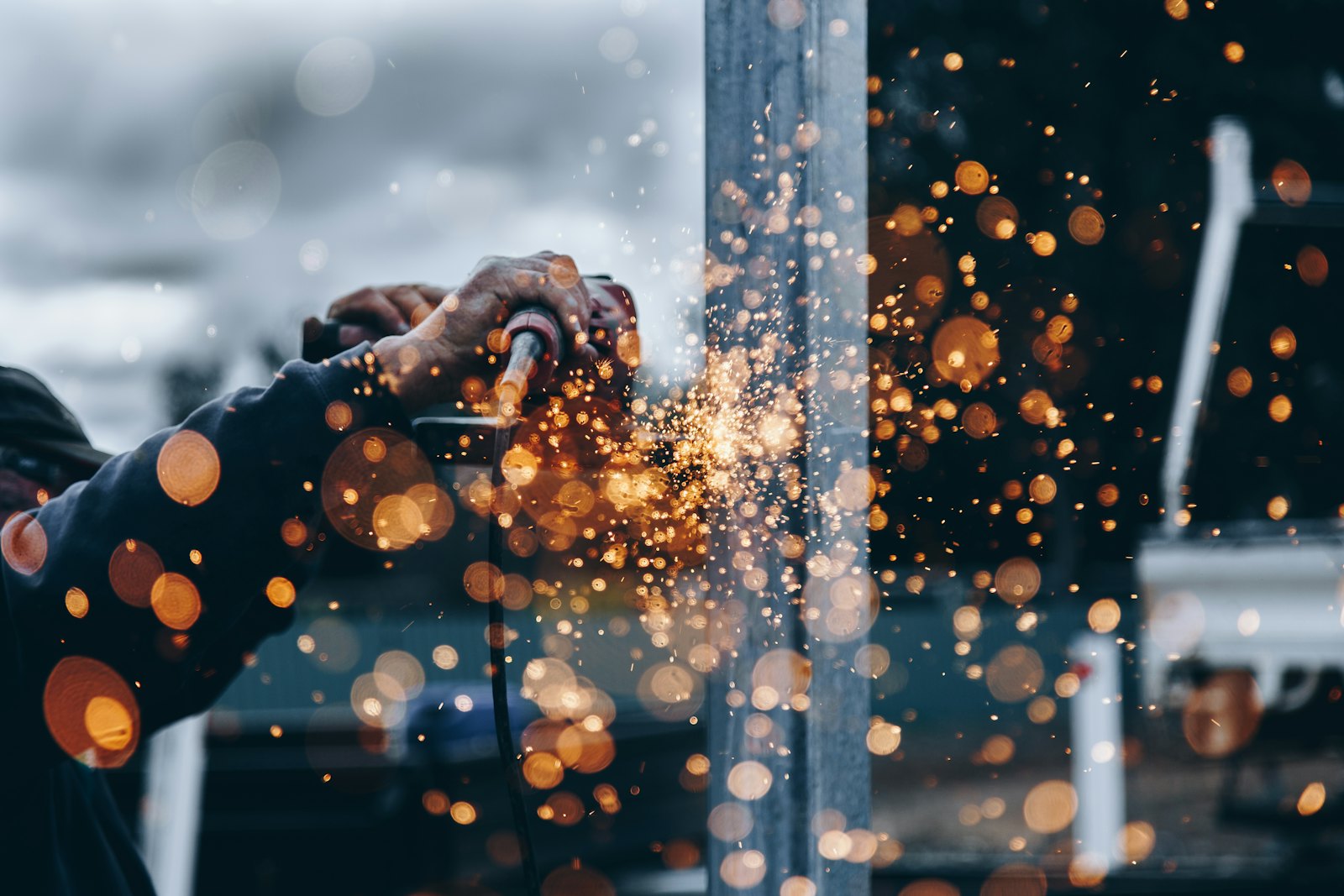Sparks flying as a panel is ground and shaped