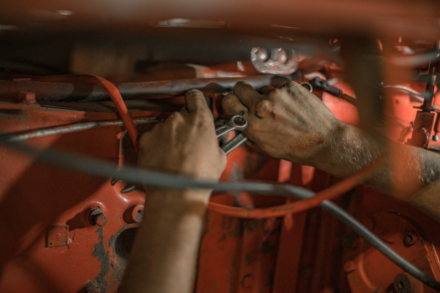 Mechanic&rsquo;s hands at work on a restoration